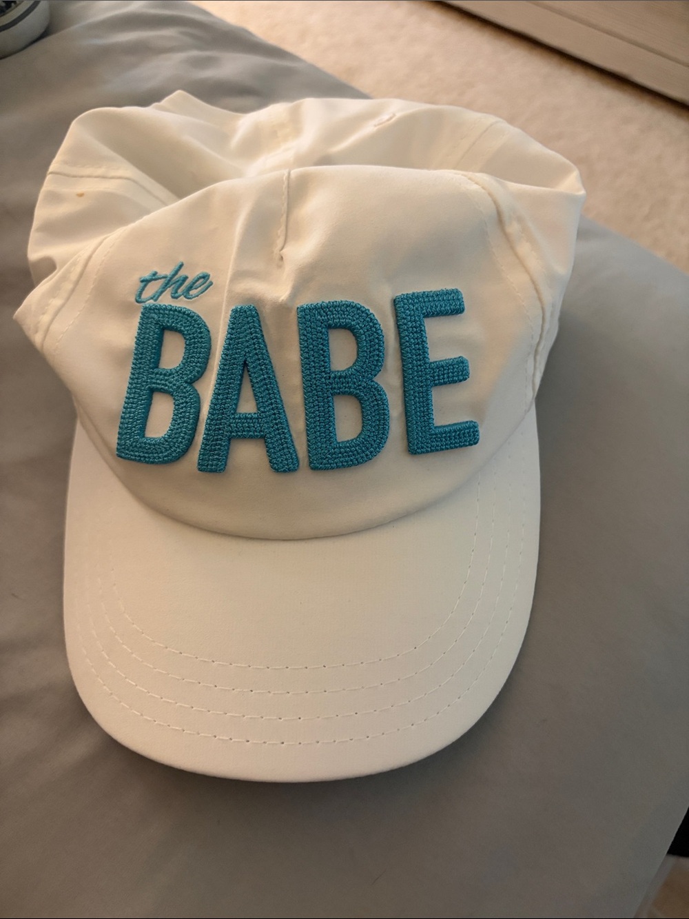White golf hat with Teal 'the BABE' Embroidery